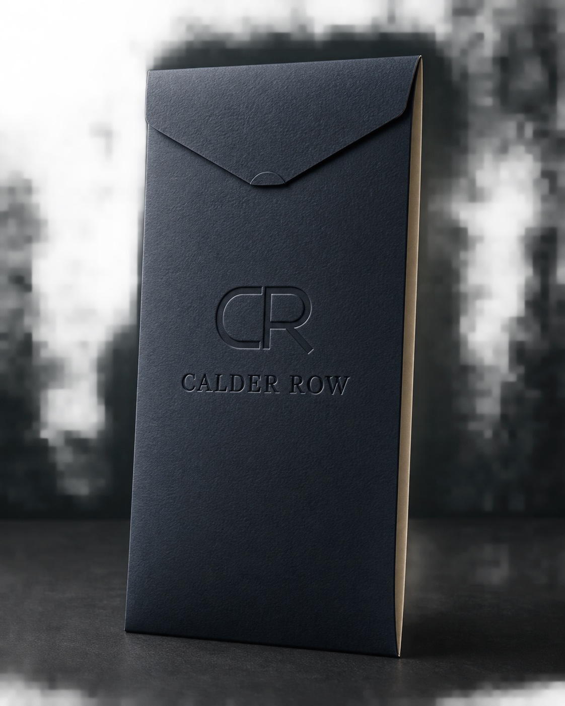 Midnight navy Calder Row golf glove envelope with a debossed CR monogram